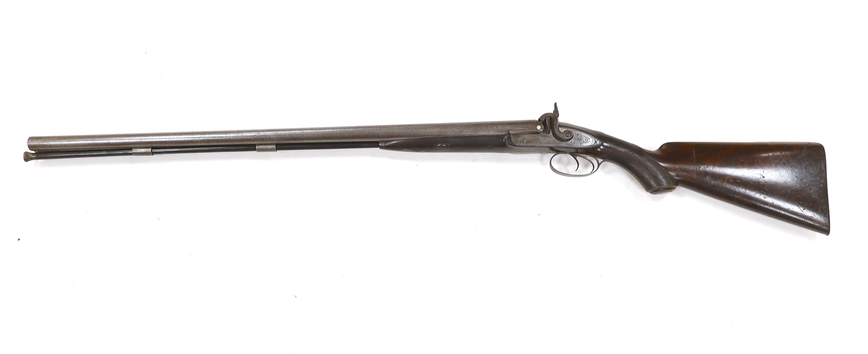 A double barrel, percussion sporting gun by F.T. Baker, half stocked, locks engraved with gundogs, iron mounts, barrels 74cm